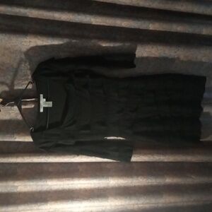 Black cocktail dress, long sleeves with ruffles all the way down